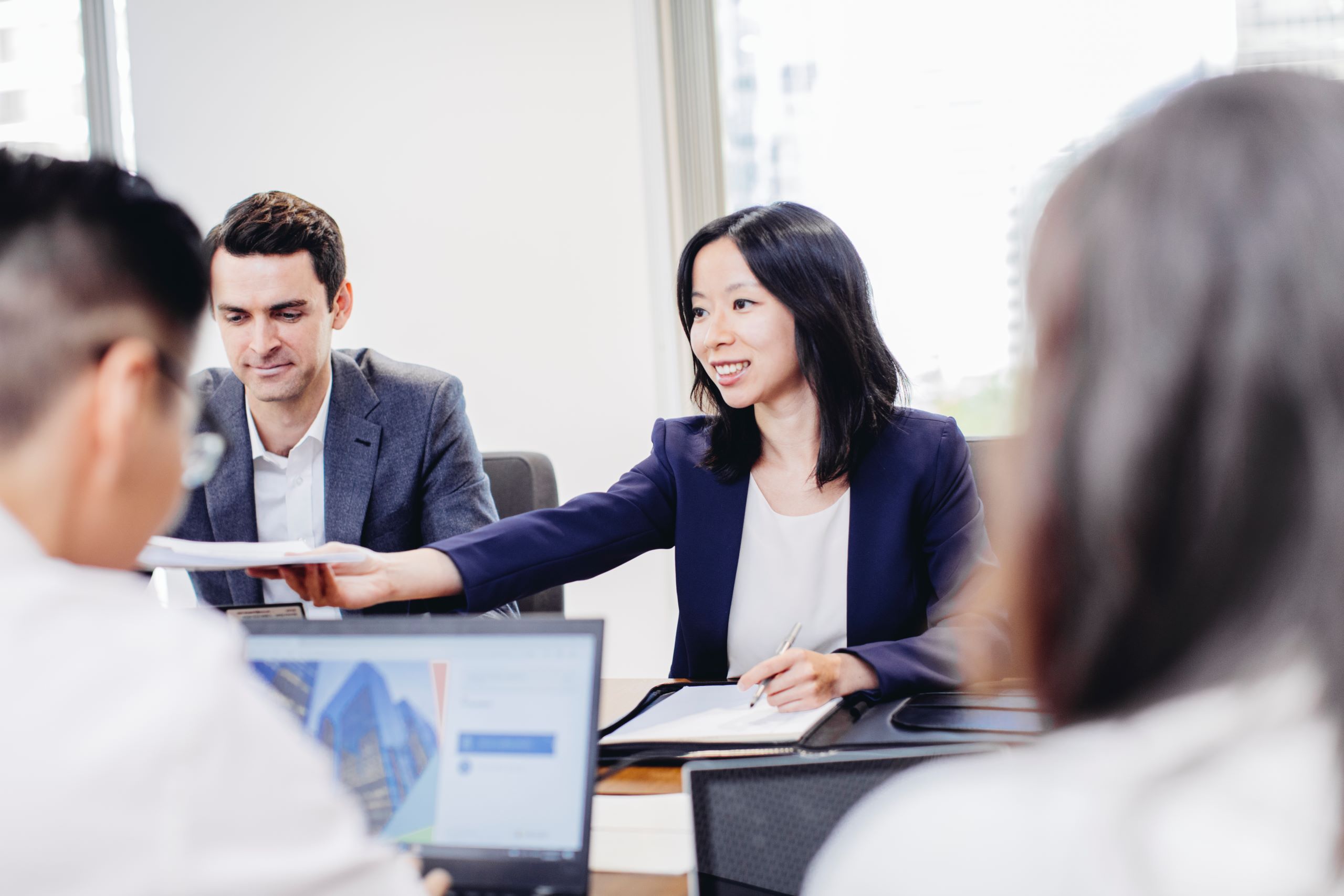 A group of people in a meeting